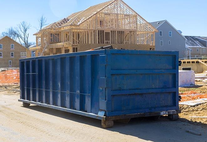 colorful dumpsters waiting for a residential clean-up